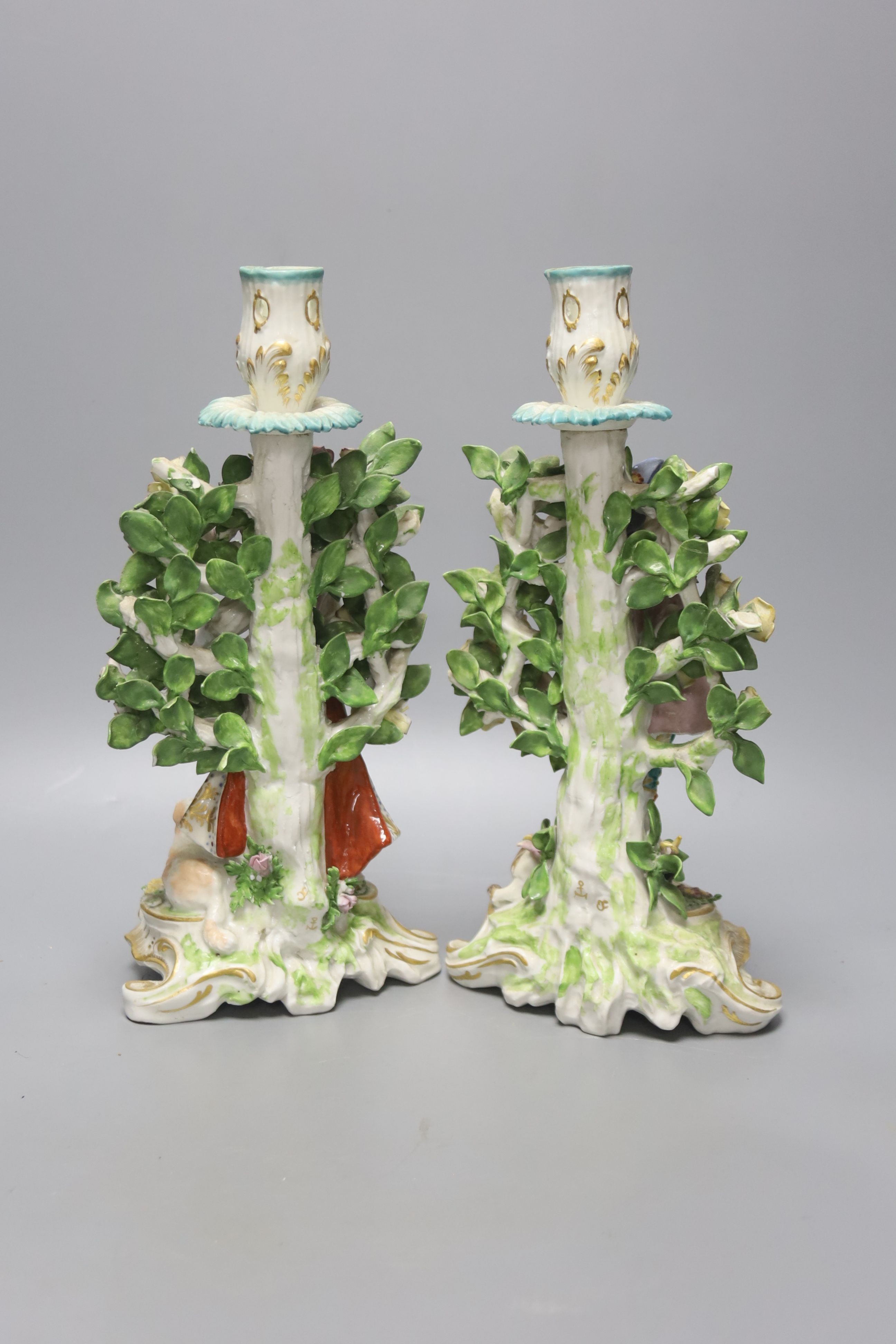 A pair of Derby style candlestick figures, height 27cm